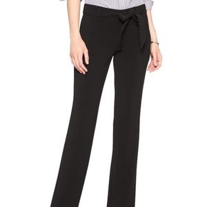 High-waisted black trousers